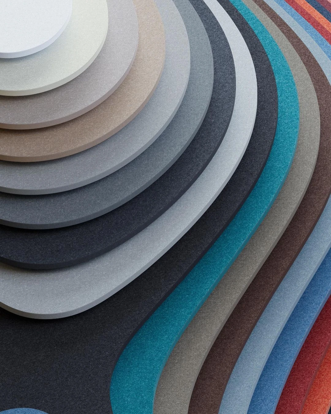Fan of PET acoustic felt colour samples in graded tones