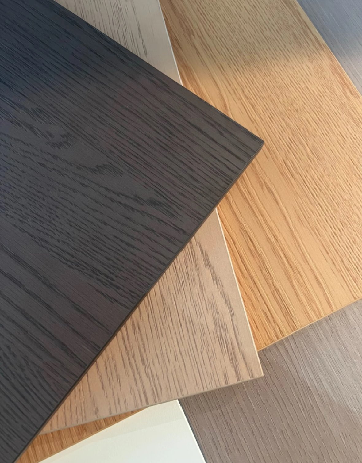 UV printed wood grain PET acoustic panel samples in dark walnut, natural oak and grey