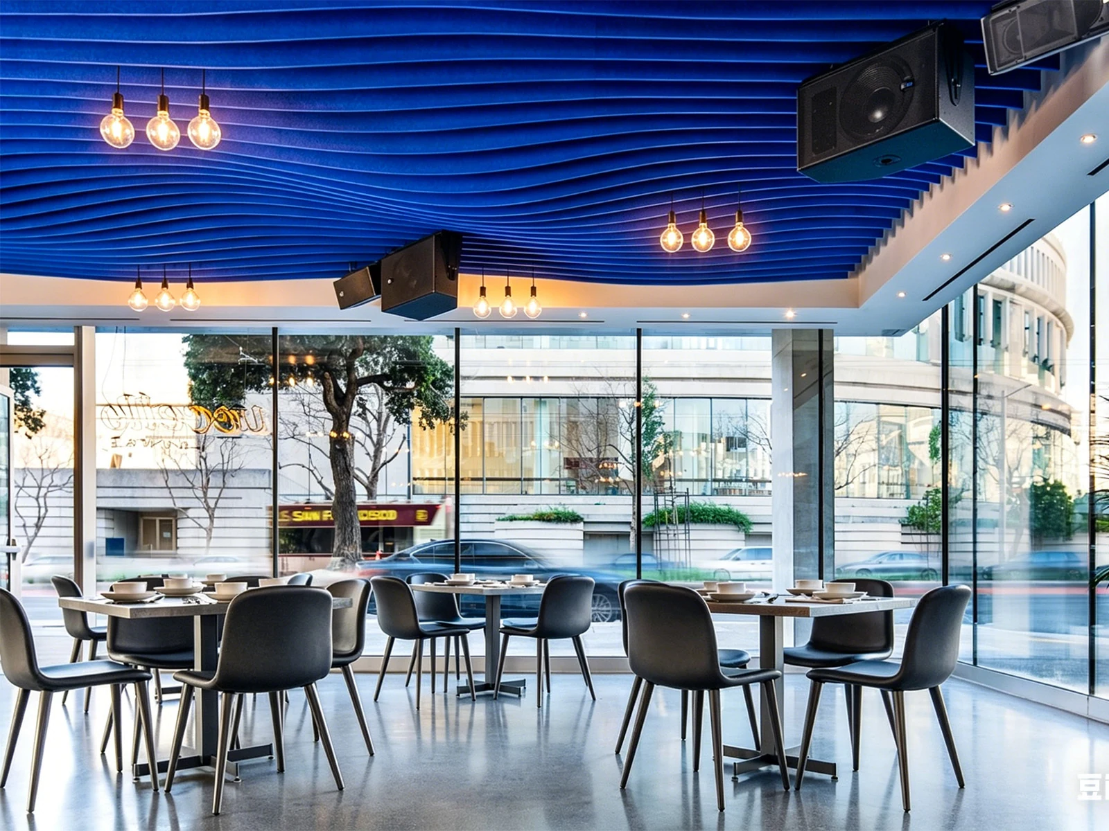 Blue wave acoustic baffles across a restaurant ceiling