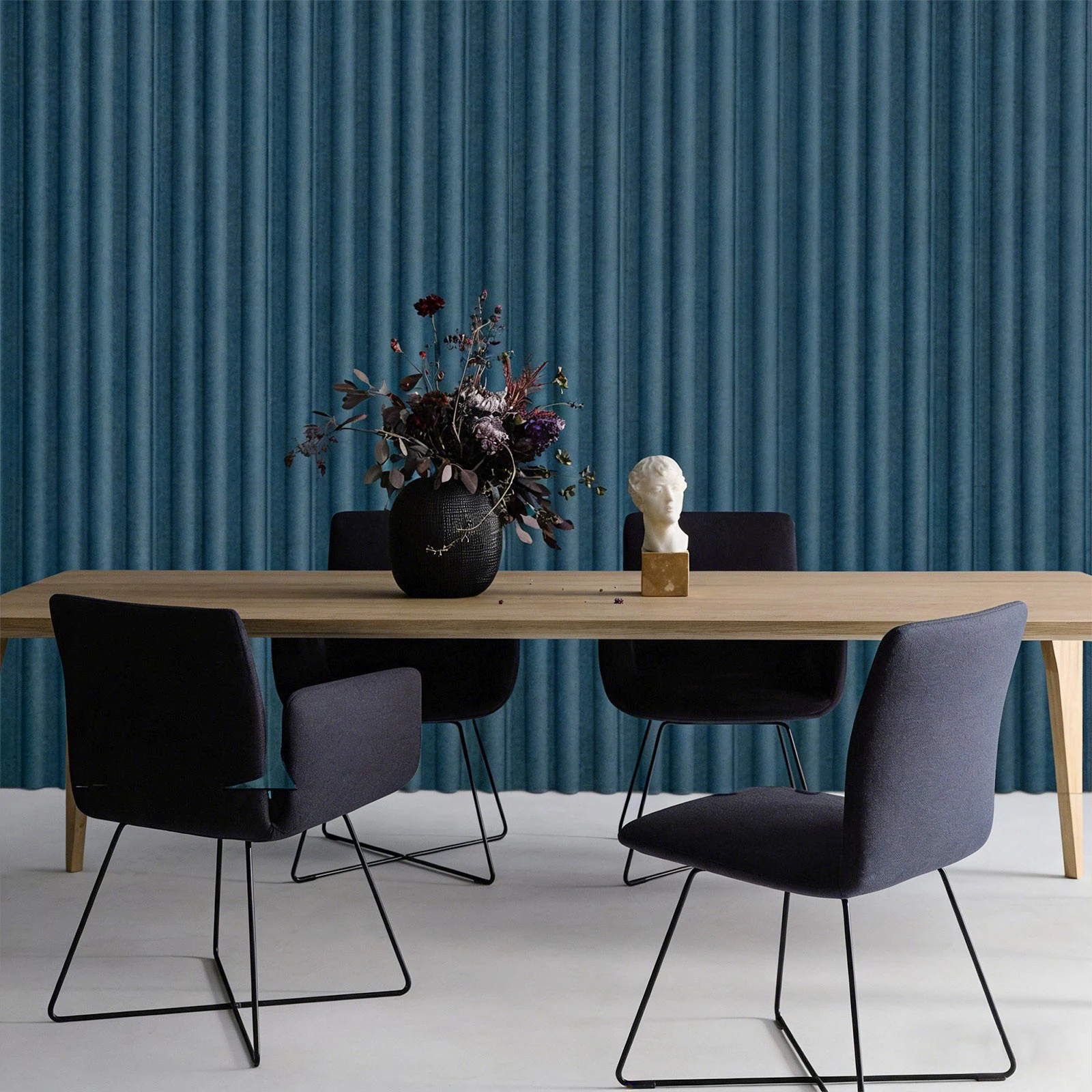 Fluted acoustic wall panels behind a commercial meeting table